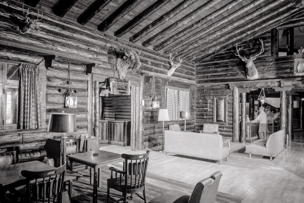 Historic view of the El Tovar Hotel lobby with log walls and mounted animal heads