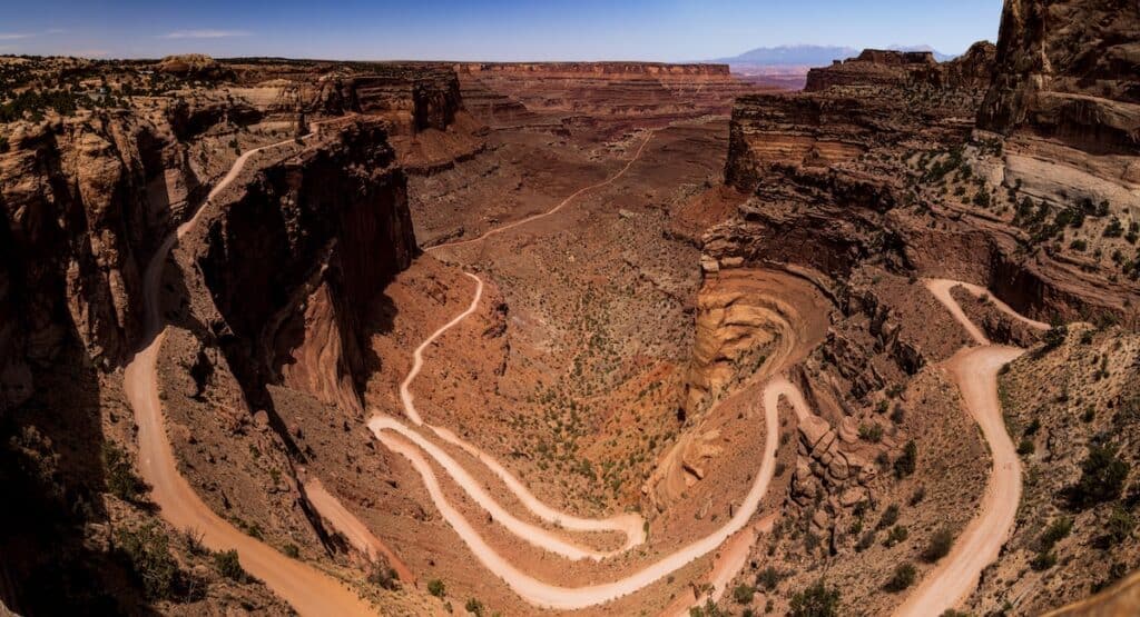 a steep unpaved road with tight switchbacks in Canyonlands National Park